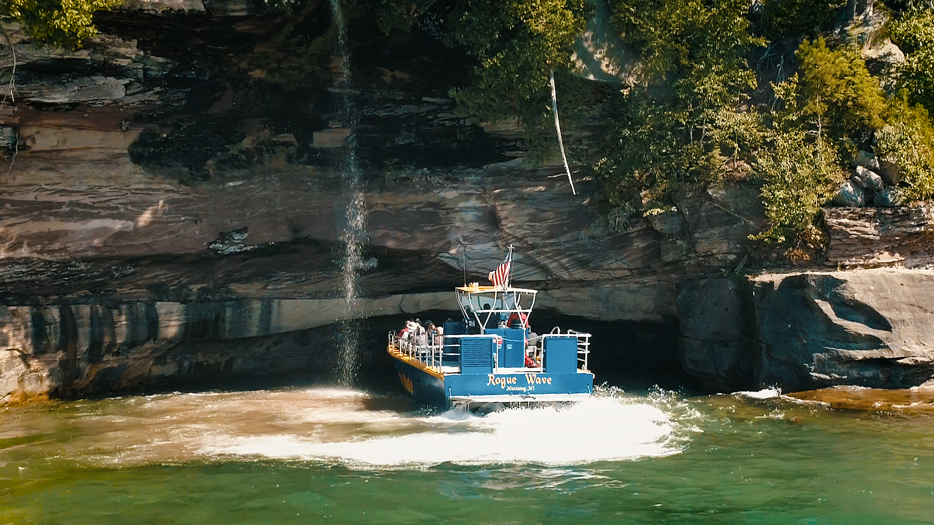 A tour boat giving a tour of Pictured Rocks, the lighthouses and shipwrecks in Lake Superior.